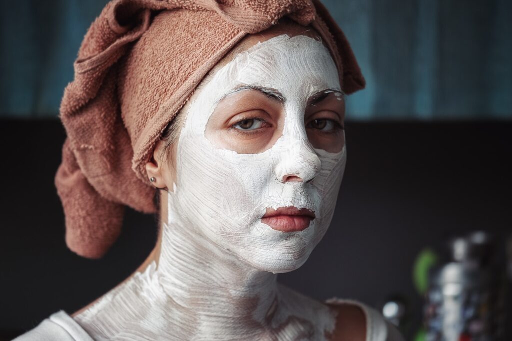 shallow focus photography of woman having a facial