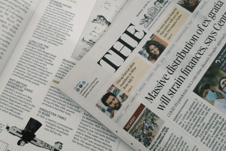 A newspaper lying over magazine